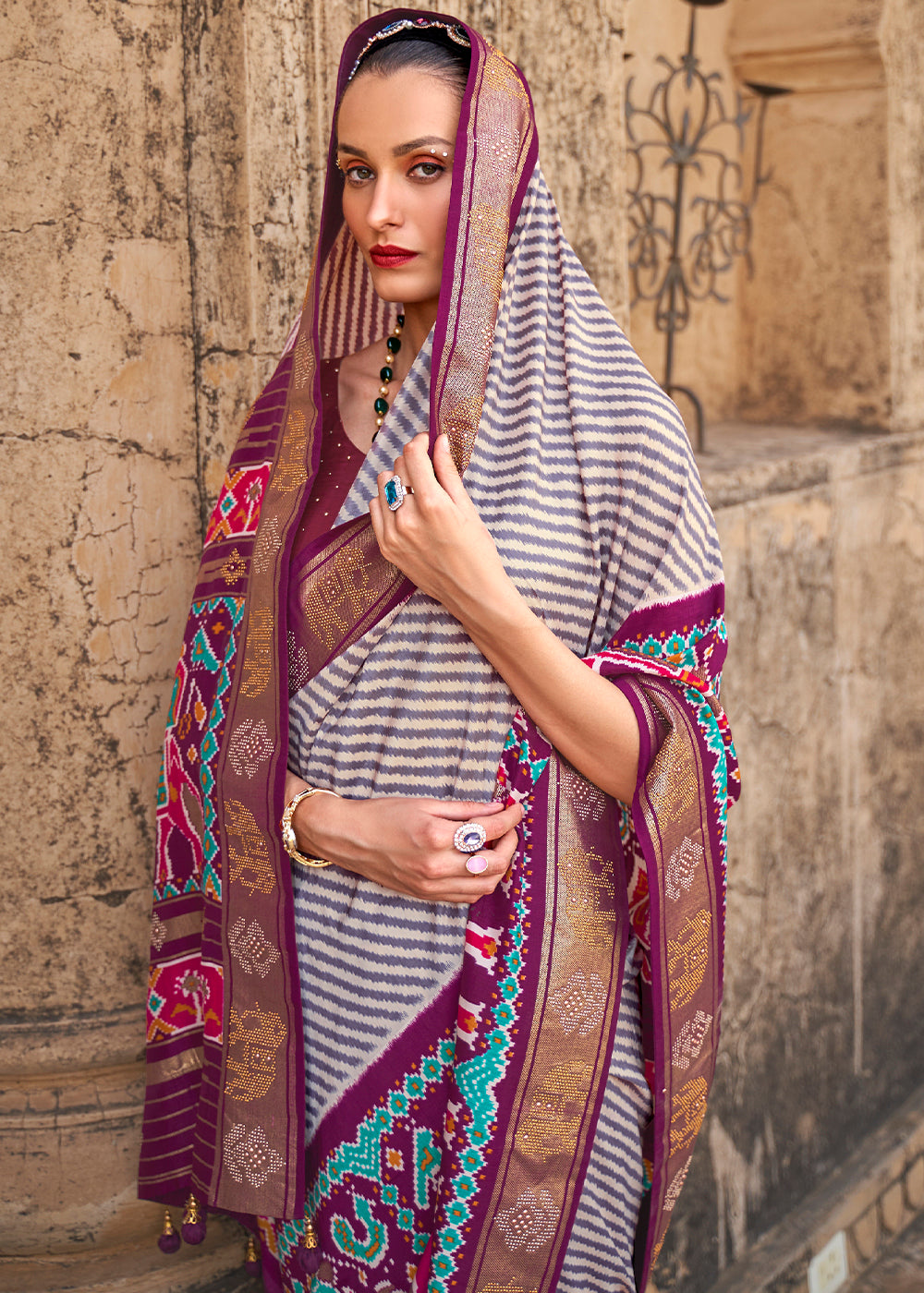 Tyrian Purple Designer Patola Silk Saree with Zari Border & Stone work