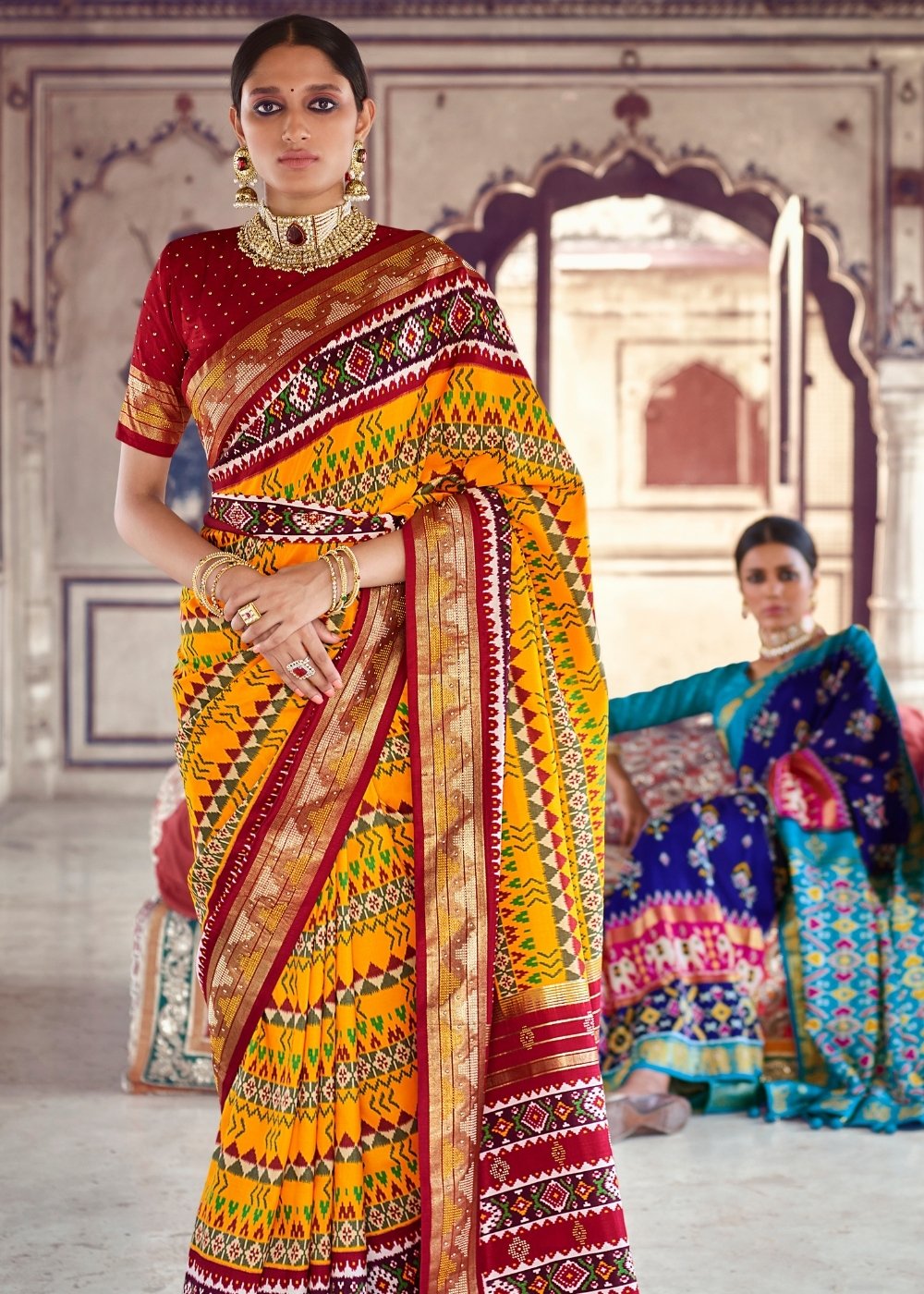 Saffron Yellow & Red Patola Silk Saree with Zari Border Pallu & Stone work