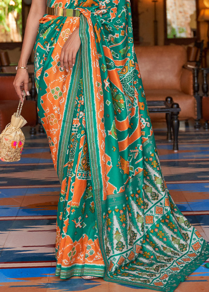 Green & Orange Printed Patola Silk Saree with Zari Border & Tassels on Pallu