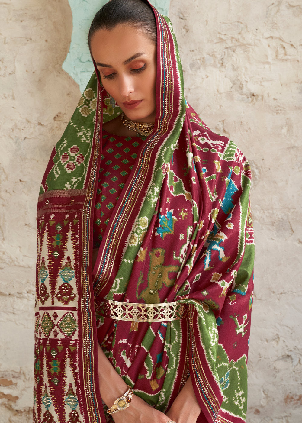 Brown & Green Printed Patola Silk Saree with Zari Border & Tassels on Pallu