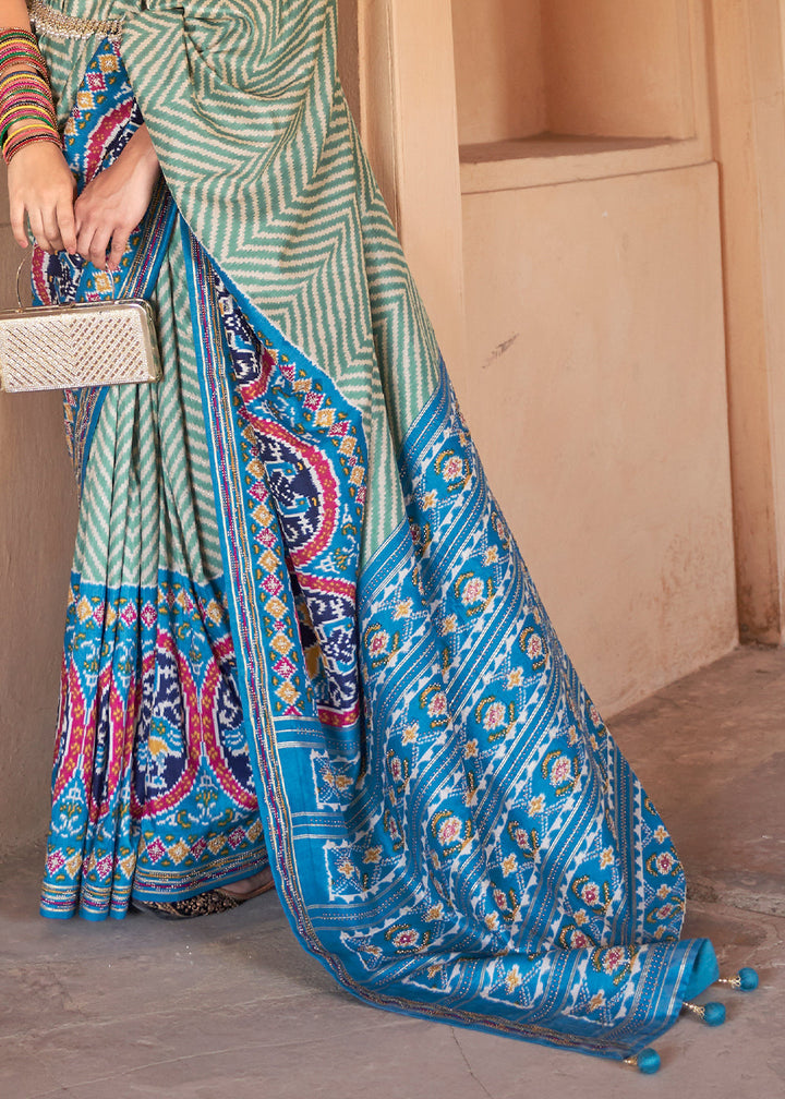 Cerulean Blue Printed Patola Silk Saree with Zari Border & Tassels on Pallu