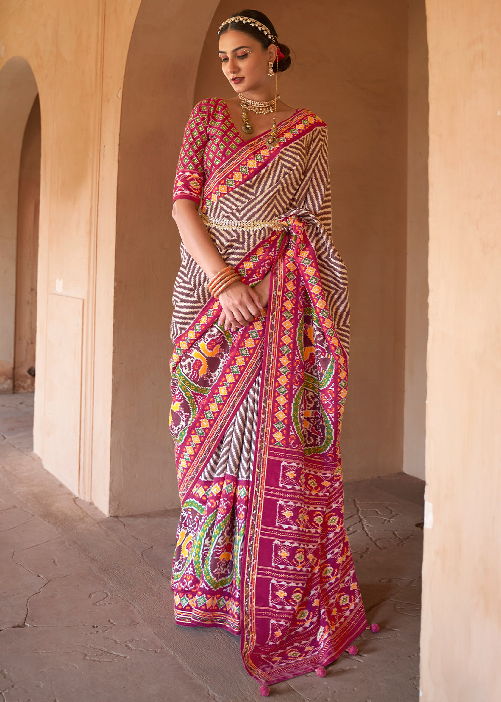 Brown & Pink Printed Patola Silk Saree with Zari Border & Tassels on Pallu