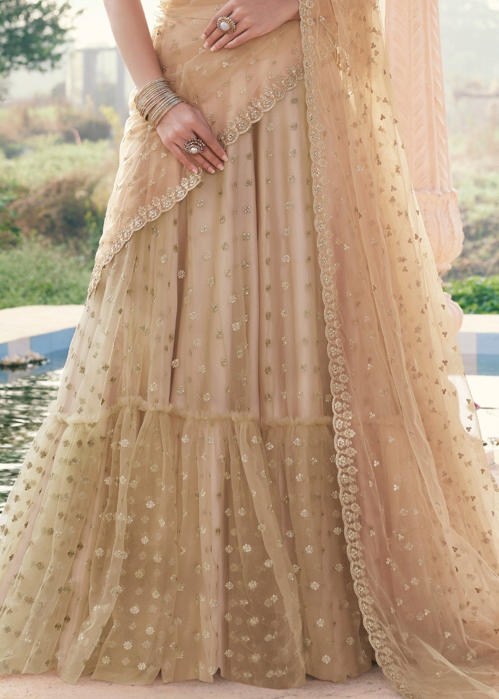 Beige Brown Net Lehenga with Zari work Paired with Satin Embroidered Blouse