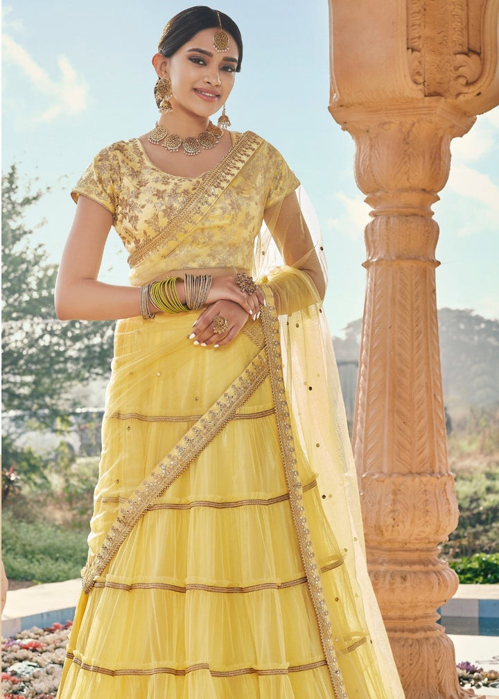 Pineapple Yellow Net Lehenga Paired with Satin Embroidered Blouse