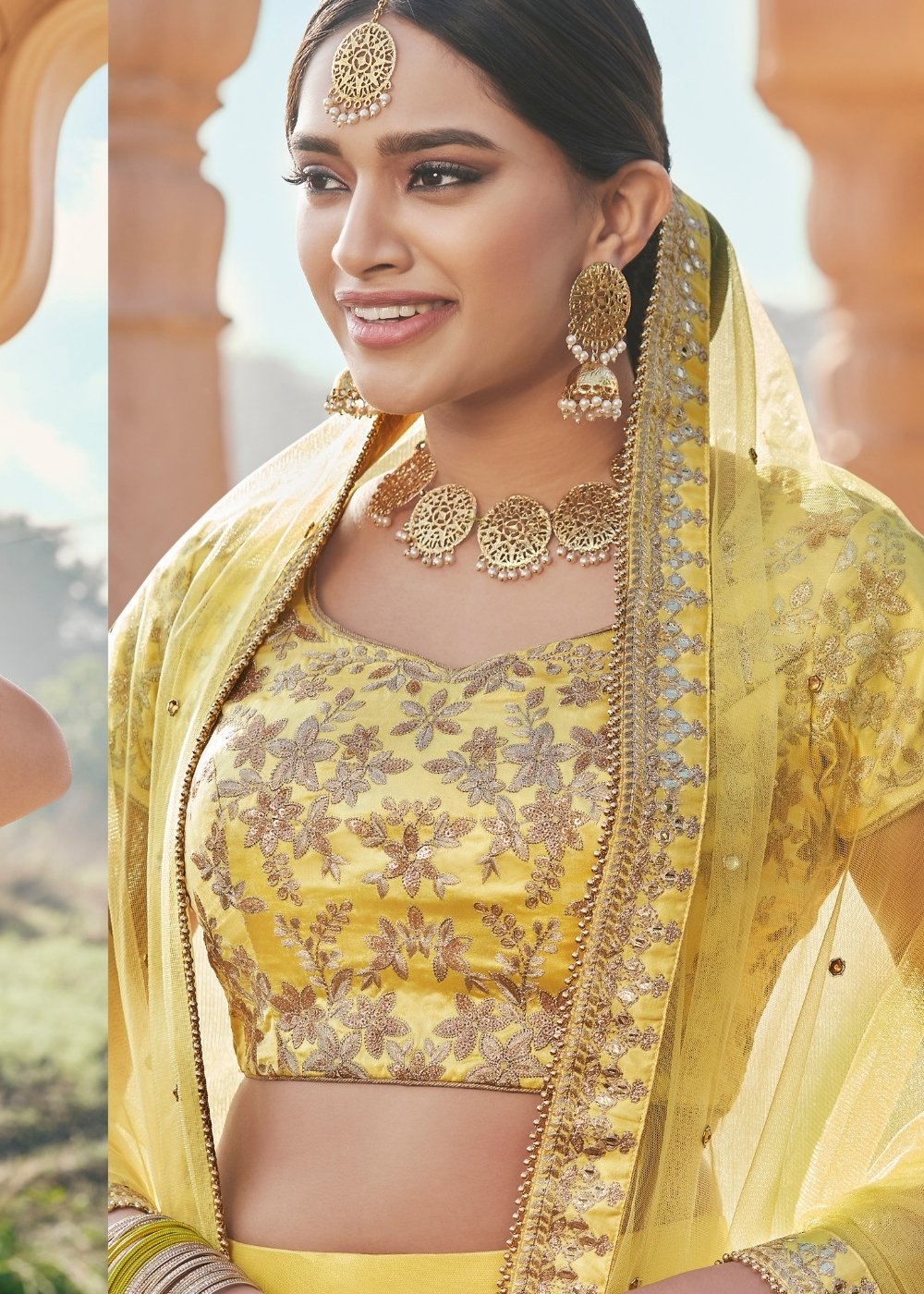 Pineapple Yellow Net Lehenga Paired with Satin Embroidered Blouse