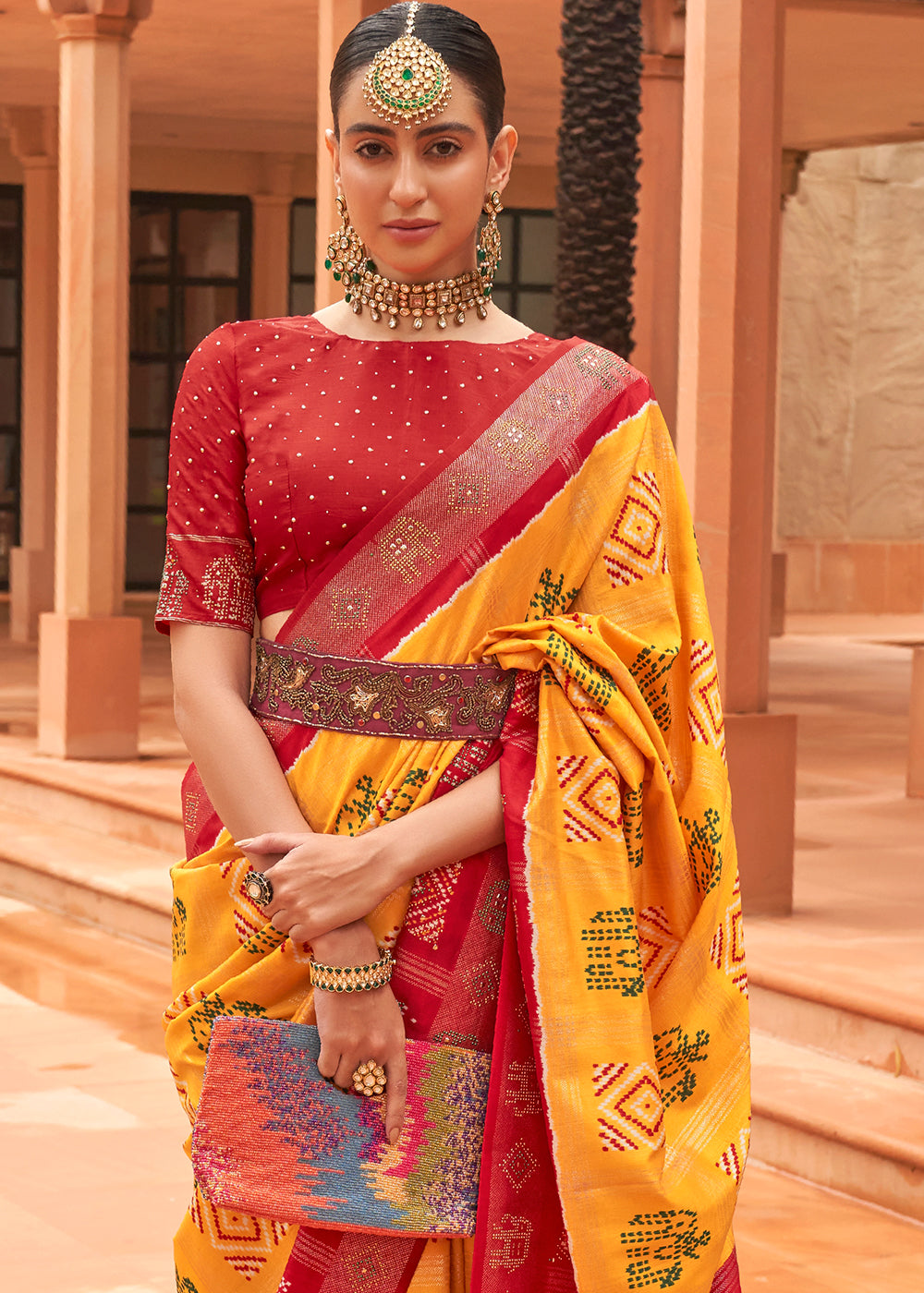 Saffron Yellow Printed Patola Silk Saree with Swaroski Work