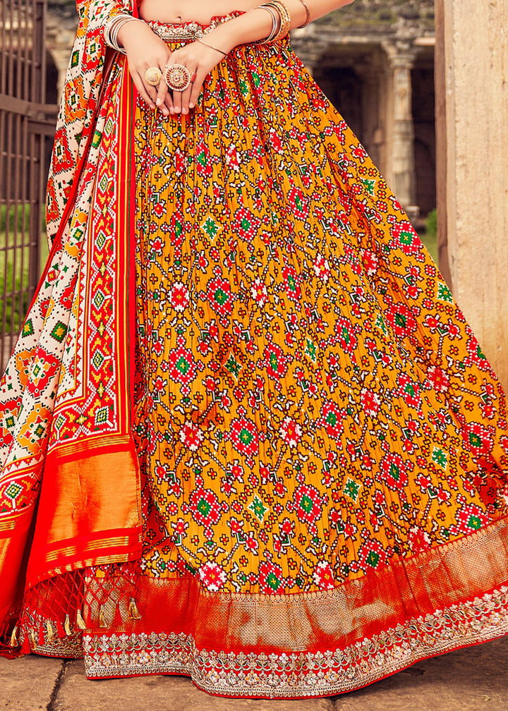 Orange & Red Patola Printed Banarasi Silk Lehenga Choli with Embroidery Work