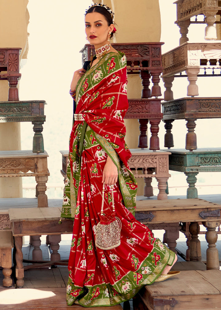 Crimson Red Printed Patola Silk Saree with Zari Border & Tassels on Pallu